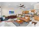 Living room opens to kitchen, featuring stylish furnishings and ample lighting at 904 Villa Venicia Way, Tampa, FL 33606