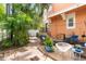 Exterior patio area with lounge seating and a grill, perfect for outdoor relaxation at 904 Villa Venicia Way, Tampa, FL 33606