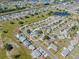 Aerial view of a suburban neighborhood, highlighting the property's location and community setting at 906 Hacienda Dr, Sun City Center, FL 33573