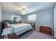 Serene bedroom with calm color scheme featuring a plush bed, and soft natural light at 906 Hacienda Dr, Sun City Center, FL 33573