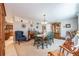 Formal dining room with carpet flooring, decorative furniture, and ample natural light at 906 Hacienda Dr, Sun City Center, FL 33573