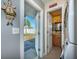 Mudroom entryway featuring a laundry room, backdoor, washer and dryer and storage space at 906 Hacienda Dr, Sun City Center, FL 33573