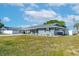 Side view of a well-maintained home, showcasing its clean lines and tidy landscaping at 906 Hacienda Dr, Sun City Center, FL 33573