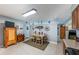 Eat-in kitchen with tile flooring, decorative shelving, and easy access to living spaces at 906 Hacienda Dr, Sun City Center, FL 33573