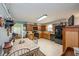 Eat-in kitchen with warm wood cabinetry, black appliances, and tile flooring at 906 Hacienda Dr, Sun City Center, FL 33573