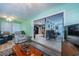 Bright living room showcasing seamless flow into kitchen and dining area on the main floor at 906 Hacienda Dr, Sun City Center, FL 33573