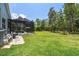 Expansive backyard with a screened-in pool, providing ample space for outdoor activities and enjoyment at 9091 Mazette Rd, Weeki Wachee, FL 34613