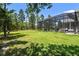 Expansive backyard with a screened-in pool, perfect for outdoor entertaining and enjoying the natural surroundings at 9091 Mazette Rd, Weeki Wachee, FL 34613