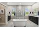 Modern bathroom featuring a soaking tub, glass enclosed shower, and dual granite vanities at 9091 Mazette Rd, Weeki Wachee, FL 34613
