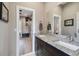 Bathroom vanity with granite countertops and wood cabinets, with a bedroom view at 9091 Mazette Rd, Weeki Wachee, FL 34613