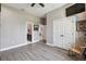 Spacious bedroom with hardwood floors and access to the ensuite bathroom and walk-in closet at 9091 Mazette Rd, Weeki Wachee, FL 34613