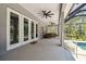 Spacious screened patio with overhead fans perfect for outdoor living at 9091 Mazette Rd, Weeki Wachee, FL 34613