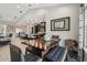 Dining area features an open layout and modern lighting with a spacious table for gatherings at 9091 Mazette Rd, Weeki Wachee, FL 34613