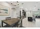 Dining area and kitchen with stainless steel appliances and a kitchen island at 9091 Mazette Rd, Weeki Wachee, FL 34613