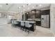 Spacious kitchen featuring granite countertops, stainless steel appliances, and a large island with bar seating at 9091 Mazette Rd, Weeki Wachee, FL 34613