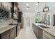 Kitchen with granite countertops, stainless steel appliances and large island with cabinets at 9091 Mazette Rd, Weeki Wachee, FL 34613