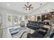 Bright living space with direct access to a screened patio and pool, alongside an open kitchen at 9091 Mazette Rd, Weeki Wachee, FL 34613
