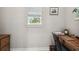 Bright office space with wood desk, natural light, and neutral wall color at 9091 Mazette Rd, Weeki Wachee, FL 34613