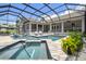 Private pool and spa surrounded by a screened enclosure at 9091 Mazette Rd, Weeki Wachee, FL 34613