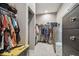 Spacious walk-in closet with extensive shelving and storage solutions for organized living at 9091 Mazette Rd, Weeki Wachee, FL 34613