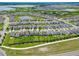 View of a residential community with neatly arranged homes and green spaces at 9324 Rally Spring Loop, Wesley Chapel, FL 33545