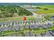 Aerial shot of homes near school with well-maintained yards and community layout at 9324 Rally Spring Loop, Wesley Chapel, FL 33545