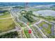 Aerial view showcasing a community near Epperson Lagoon, featuring residential homes, green spaces, and recreational areas at 9324 Rally Spring Loop, Wesley Chapel, FL 33545