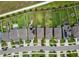 Aerial view highlighting the property's backyard, neighboring houses, and street layout within a residential community at 9324 Rally Spring Loop, Wesley Chapel, FL 33545