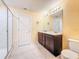 Bathroom featuring a double vanity and glass shower at 9324 Rally Spring Loop, Wesley Chapel, FL 33545
