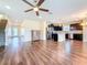 Expansive living room showcases an open layout, blending seamlessly with the kitchen and dining area at 9324 Rally Spring Loop, Wesley Chapel, FL 33545