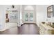 Spacious foyer featuring wood floors, high ceilings, and an inviting entrance with views into other living spaces at 10231 Millport Dr, Tampa, FL 33626