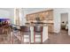 Kitchen island with granite countertops and seating at 10231 Millport Dr, Tampa, FL 33626