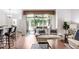 Cozy living room with sliding glass doors to a patio, and dark wood flooring at 10231 Millport Dr, Tampa, FL 33626