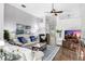 Bright living room with comfortable seating, ceiling fan, and elegant decor at 10231 Millport Dr, Tampa, FL 33626