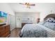 Bedroom featuring a ceiling fan and shuttered windows at 10231 Millport Dr, Tampa, FL 33626