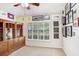 Well-lit home office with built-in shelving, neutral walls, and a window providing natural light for work or study at 10231 Millport Dr, Tampa, FL 33626