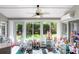Sunroom playroom filled with toys, a learning center, and a great view of the landscaped backyard at 10231 Millport Dr, Tampa, FL 33626