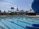 Community pool featuring sparkling water, lounge chairs, and a slide for summer fun at 10231 Millport Dr, Tampa, FL 33626