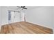 Bedroom features sliding barn door to bathroom and vinyl flooring at 10701 Glen Ivy Ln, Tampa, FL 33624
