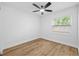 Bedroom featuring ceiling fan and window at 10701 Glen Ivy Ln, Tampa, FL 33624