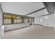 Enclosed patio with a neutral color scheme and ample lighting, providing a great space for outdoor relaxation and entertainment at 10701 Glen Ivy Ln, Tampa, FL 33624