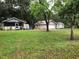 Charming single-story home with a well-maintained lawn and a detached garage at 118 W 122Nd Ave, Tampa, FL 33612