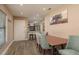 Cozy dining area with seating for four, seamlessly connected to the living room and kitchen at 1250 S Pinellas Ave # 214, Tarpon Springs, FL 34689