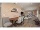 Open-concept living space with dining area flowing into the living room and kitchen at 1250 S Pinellas Ave # 214, Tarpon Springs, FL 34689