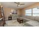 Comfortable living room with a large sectional sofa, neutral tones, and natural light at 1250 S Pinellas Ave # 214, Tarpon Springs, FL 34689