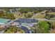 Aerial view of the golf course and clubhouse with lush green landscaping at 12705 Green Heron Way, Odessa, FL 33556