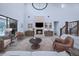 Spacious living room with a stone fireplace, built-in cabinets, and staircase access at 12705 Green Heron Way, Odessa, FL 33556