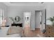 Spacious main bedroom featuring wood floors and access to the ensuite bathroom at 12705 Green Heron Way, Odessa, FL 33556
