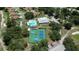 Aerial view of the community amenities including the pool, tennis, and pickleball courts at 13423 Crest Lake Dr, Hudson, FL 34669