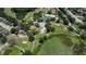 Community golf course with the pool and clubhouse amenities and views of a nearby pond at 13423 Crest Lake Dr, Hudson, FL 34669